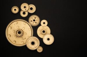 A series of clockwork cogs. Write Good.